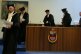 Ankündigung auf dem Bildschirm beim Eingang der Aula
